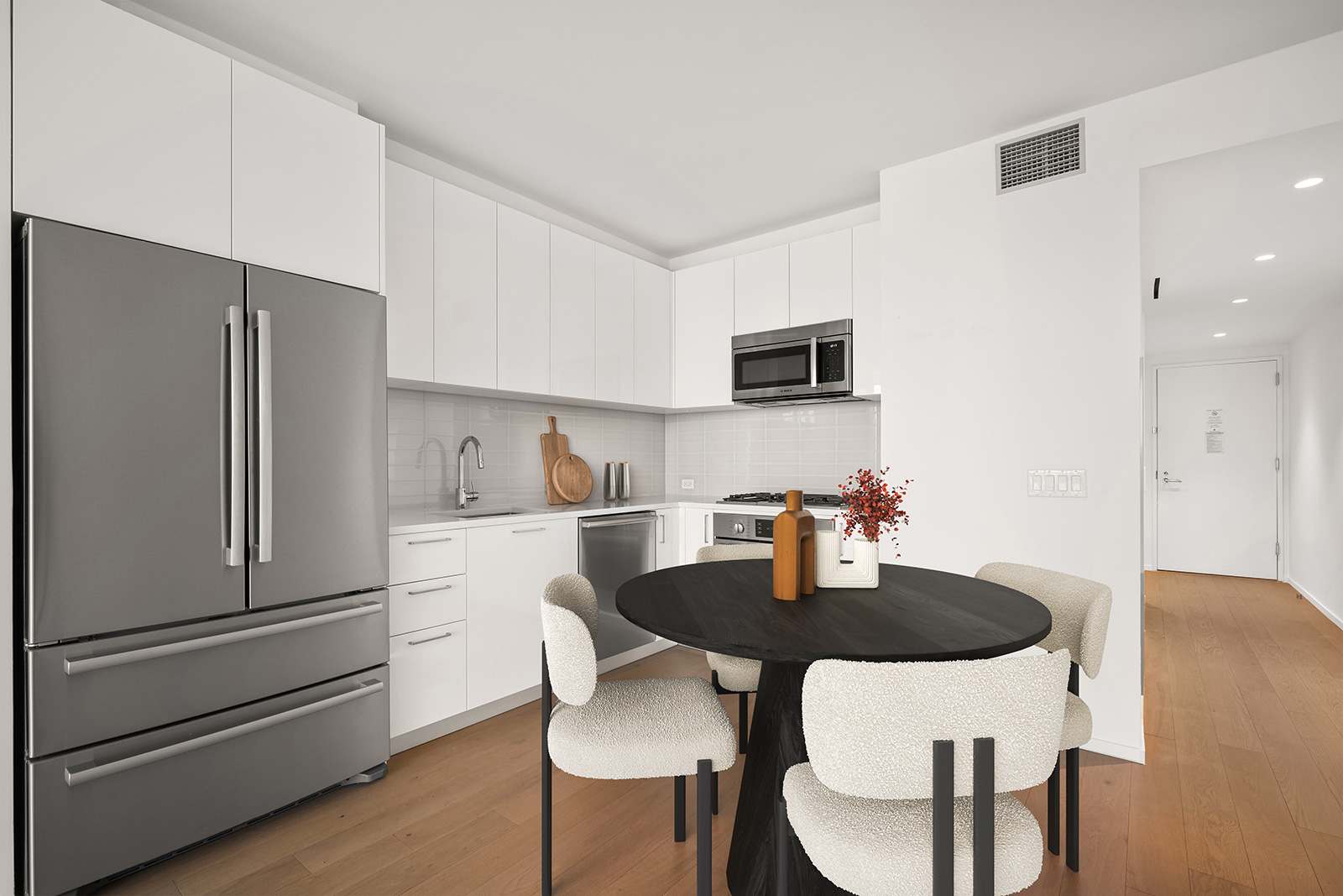 Modern kitchen with white countertops, sleek finishes, and open layout at 685 1st ave, apartments for rent in Murray Hill.