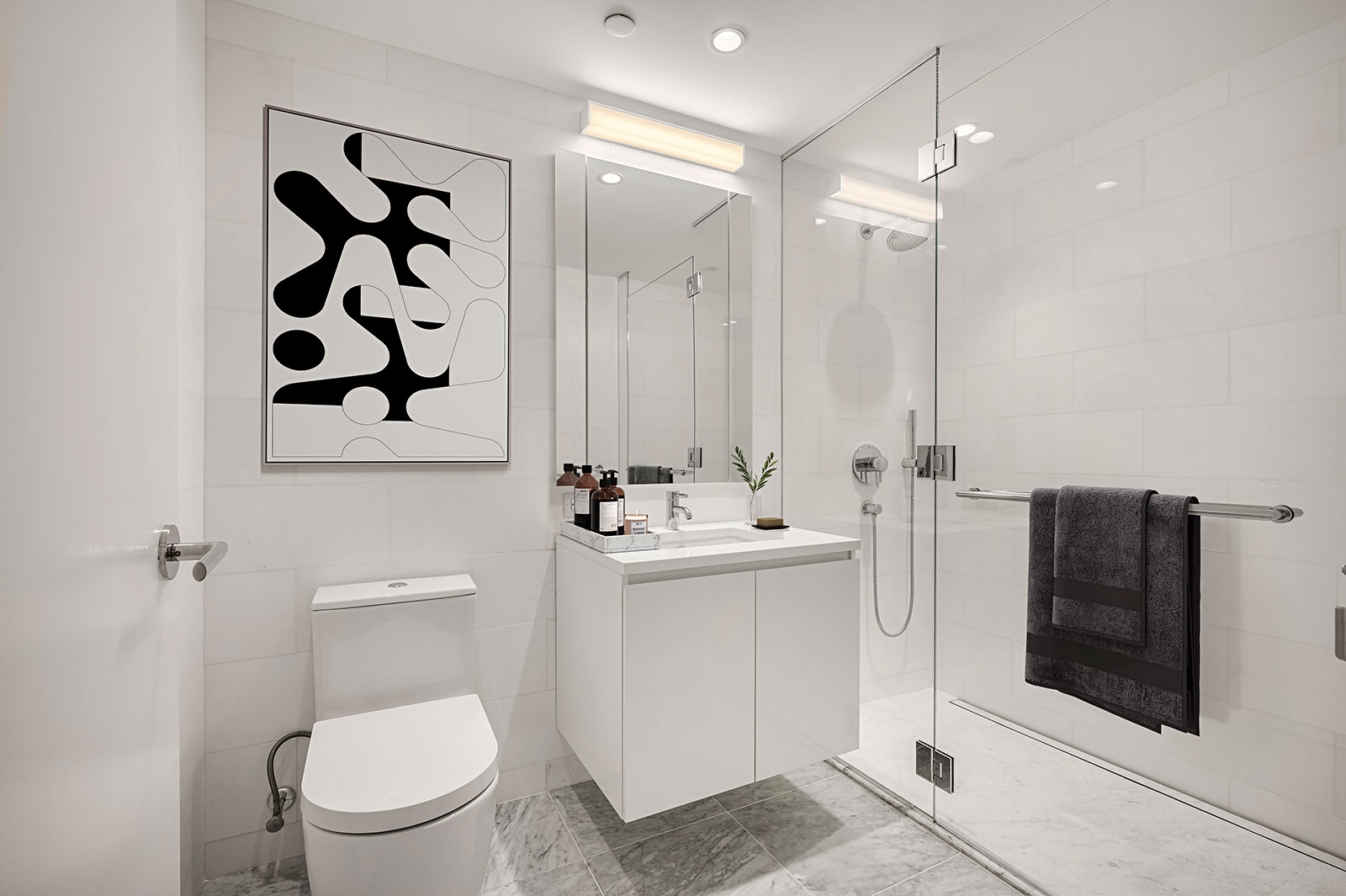 Modern bathroom with white countertops and sleek finishes at 685 First Avenue, apartments for rent in Murray Hill.